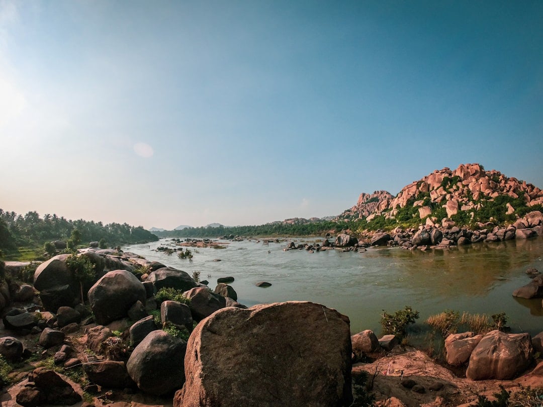 brown-rocks-near-body-of-water-during-daytime.jpeg