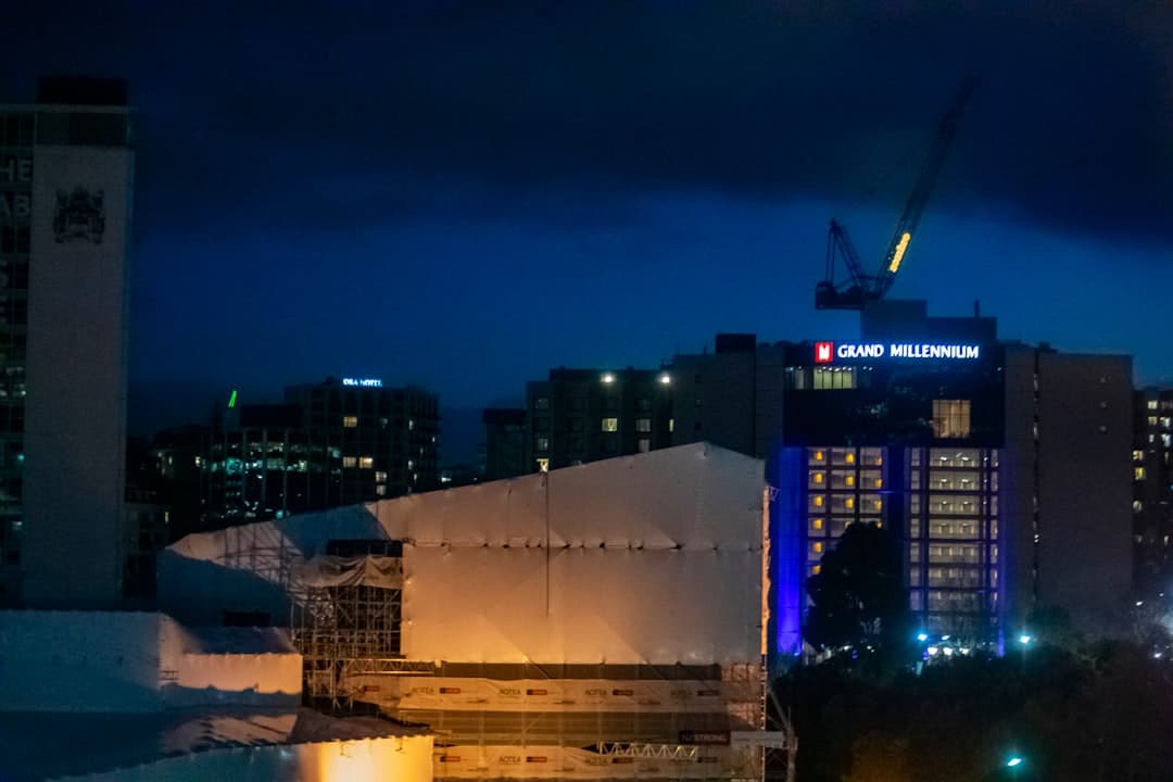 a view of a city at night from a rooftop