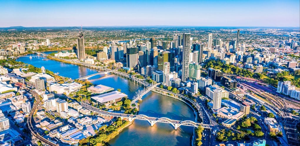 city skyline under clear blue sky during daytime