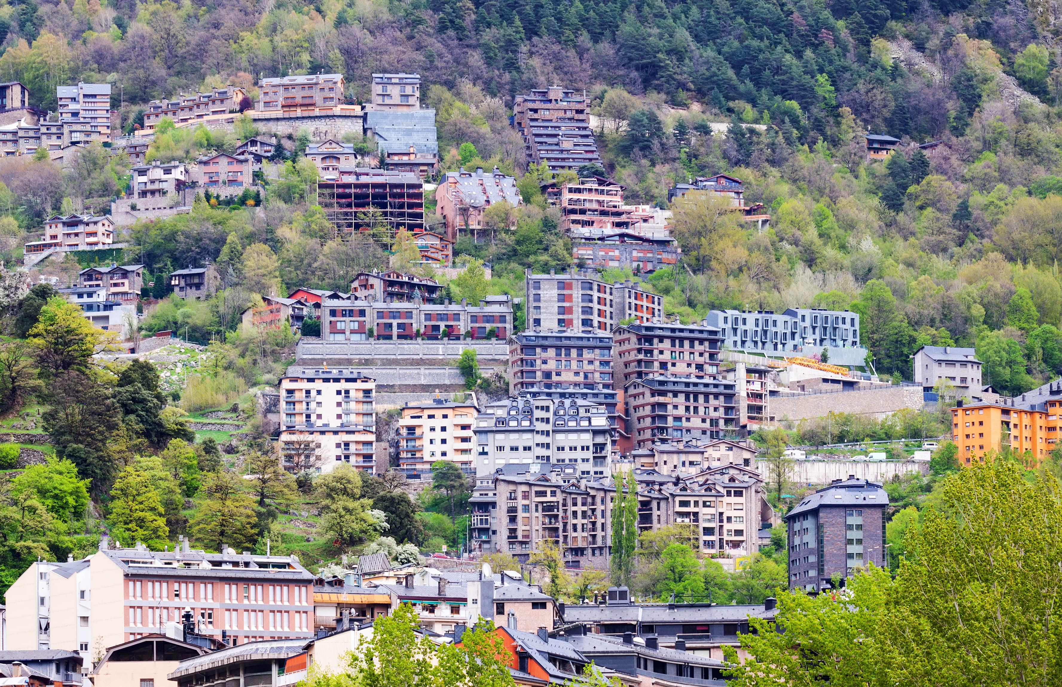 a scenic view of a mountain with a winding road